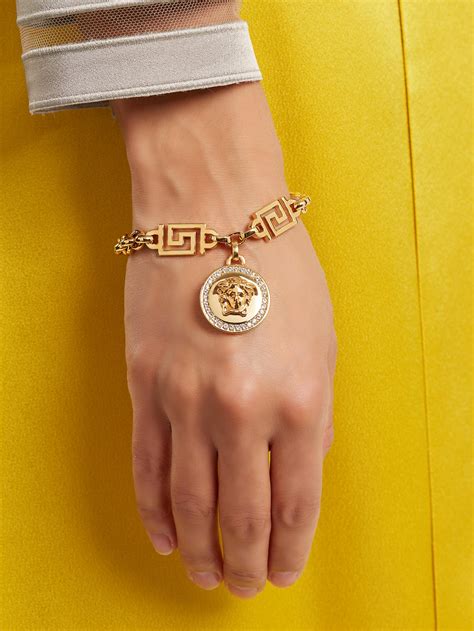 versace gold charm bracelet|versace medusa gold bracelet.